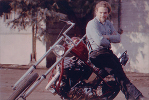 Nik with red motorcycle